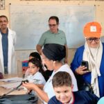 جانب من لقطات التوزيع الميداني للمحافظ المدرسية لجمعية تافوغالت